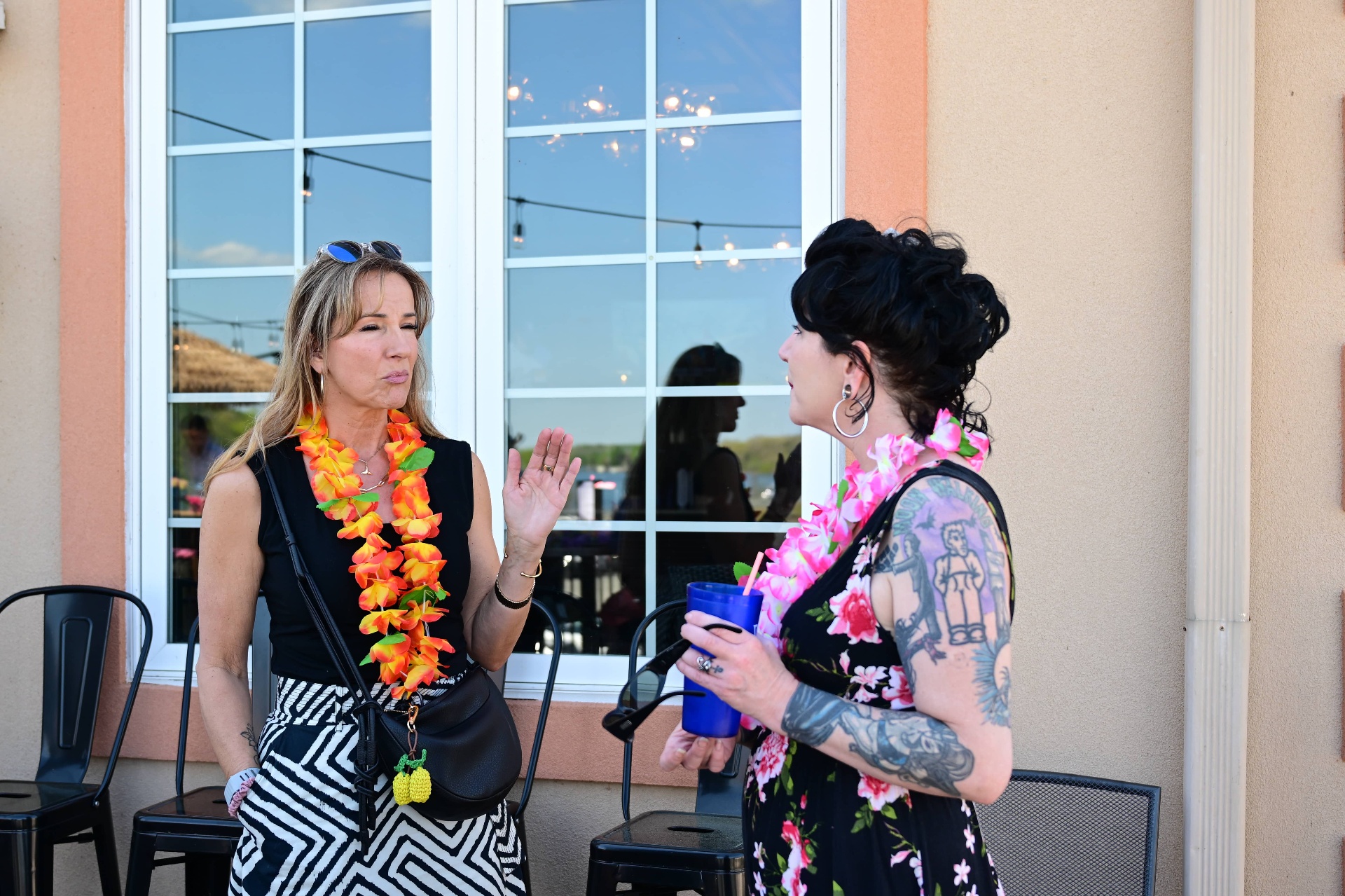 Friends chatting with leis at Vito's